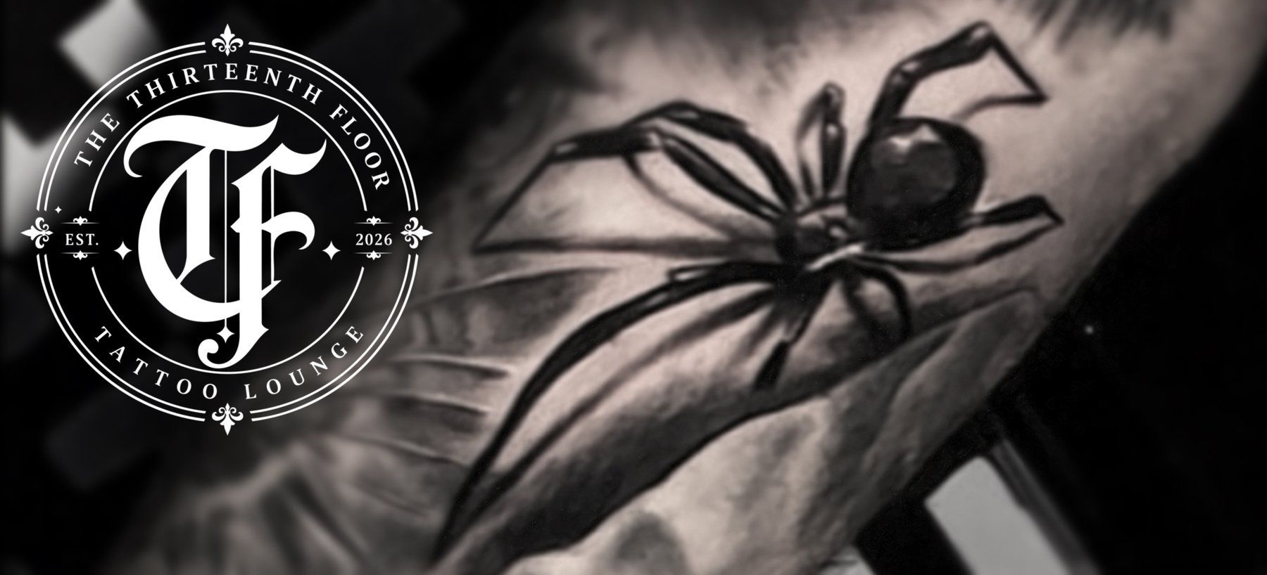 Black and grey spider tattoo close-up, The Thirteenth Floor Tattoo Lounge